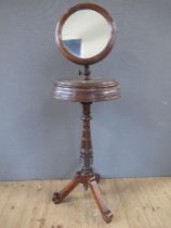 A late Victorian/Edwardian  shaving stand, with adjustable mirror, raised on turned column,
