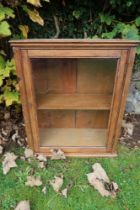 A pine glazed cabinet , width 25ins, height 30ins