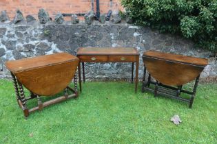 A mahogany writing table, width 40ins, depth 18ins, height 30ins, together with 2 oak gate leg