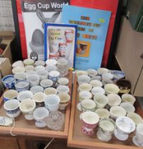 A collection of egg cups, together with books and a wash set