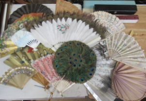 A collection of fans, and four boxes