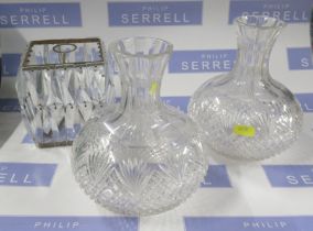 A pair of glass carafes, together with a light shade