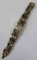 Schiaparelli, a 1967 wrist watch, the bracelet strap decorated with green and gilt metal circles,