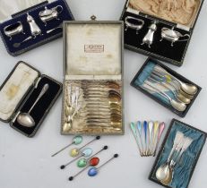 A collection of cased spoon sets, to include ELo Denmark Sterling scoops, enamel back coffee bean