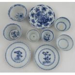 A collection of 18th century and 19th century blue and white porcelain tea bowls and saucers