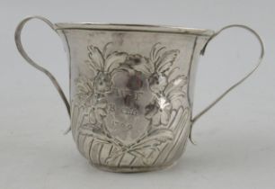 A Georgian silver porringer, with embossed decoration and scroll handles, London 1764, maker D
