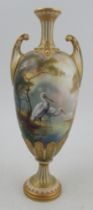 A Royal Worcester pedestal vase, decorated all round with a landscape and storks by W Powell, height