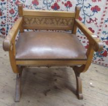 An oak ecclesiastical/Glastonbury Chair, with carved decoration