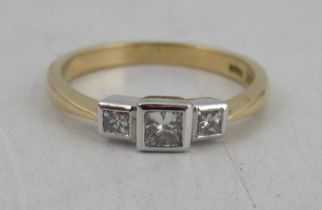An 18ct gold three stone diamond ring,  1 diamond, weight 0.22ct, 2 diamonds total weight 0.2ct,