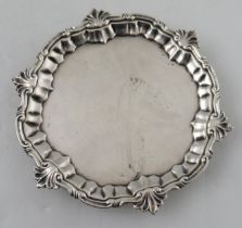 A Georgian silver salver, with shaped border on three hoof feet, London 1750, maker William Peaston,