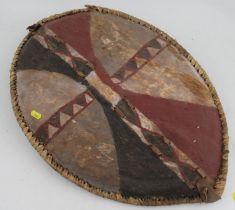 A Masi 1950's tribal shield, Kenya/Tanzania border, together with a spear head