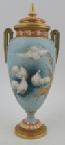 A Royal Worcester covered vase, decorated with four fan tail doves to a powder blue ground by CHC