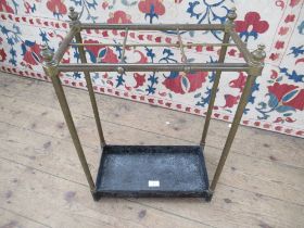 A brass 6 division stick stand, width 16ins, height 24ins