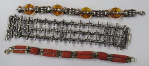 A white metal Continental bracelet, stamped RO, together with a coral bracelet, and a silver and