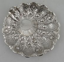 A silver circular dish, with pierced and embossed decoration, Sheffield 1898, weight 8oz, diameter
