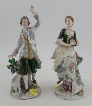 A pair of Sitzendorf porcelain figures, height 11ins and 10ins