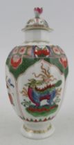 An 18th century Worcester porcelain teapoy, decorated with the Dragon in Compartments pattern,