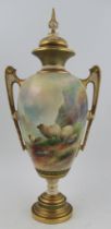 A Royal Worcester covered pedestal vase, decorated with sheep in landscape by H Davis, shape