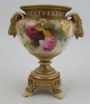 A Royal Worcester vase, the quarter lobed body decorated with roses, with gilt ram mask handles, a