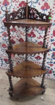 A 19th century four tiered rosewood corner whatnot, height 52ins, width 23ins