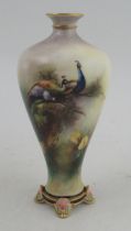 A Hadleys Worcester vase, decorated with nesting peacocks, height 7ins
