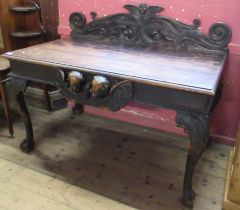 An Antique oak serving table, with carved super structure, having carved frieze decoration, of