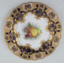 A Royal Worcester cabinet plate, the centre decorated with fruit by Sebright, with a rich dark