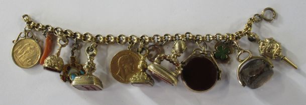 A yellow gold belcher link charm bracelet, suspending a 20 mark coin, a 20 frank coin, four