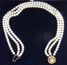 A three strand pearl choker necklace, with 9ct gold ad pearl set clasp
