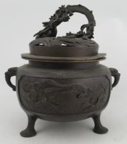A Japanese late Meigi period Koro with cover, having elephant mark handles and dragon finial, height