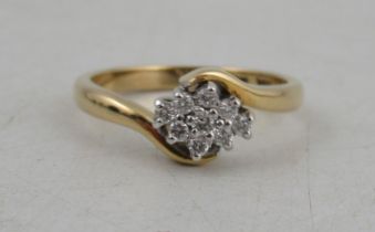 An 18ct gold diamond cluster ring, weight 4g, 1 stone -weight 0.03ct, 8 stones , total weight 0.