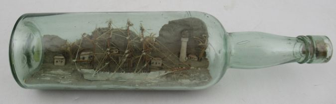 A model ship in a glass bottle, length 12ins