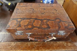 A vintage snakeskin travelling case,  width 15ins