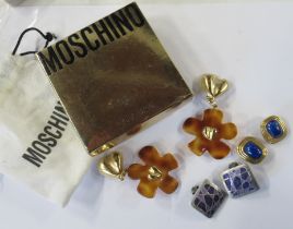 A pair of Christian Dior simulated lapis lazuli earrings, together with a pair of Moschino earrings,