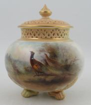 A Royal Worcester covered pot pourri, decorated with pheasants in landscape by James Stinton, with