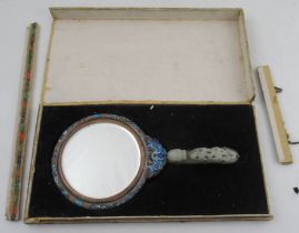 A Chinese enamelled ladies hand mirror, with a 19th century dragon green hard stone belt buckle
