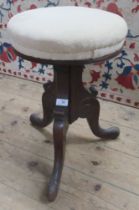 A Victorian style mahogany piano stool