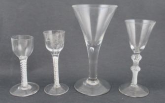 Two Antique drinking glasses, with white cane twist to the stems ad one with etched decoration to