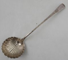 A Georgian silver feather edge pattern soup ladle, having a shell bowl, London 1776, maker Hester