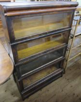 A Globe Wernicke four section glassed bookcase, missing one glass panel, width 34ins, height 54ins