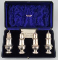 A cased set of four silver caster pepperettes, Chester 1907, height 4.75ins