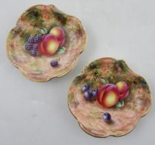 A pair of Royal Worcester dishes, decorated fruit to a mossy background by Freeman, diameter 4.75ins