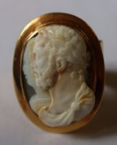 A gold cameo shell ring, with carved double bust portrait of Roman Emperor and female, in polished