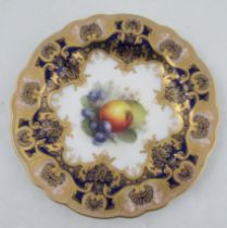 A Royal Worcester cabinet plate, the centre decorated with fruit by Sebright, with a rich dark