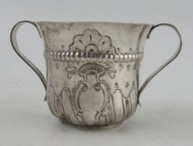 A Georgian silver two handled porringer, with embossed decoration, London 1769, maker IK, 3 1/8
