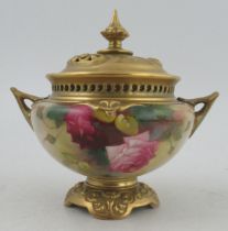 A Royal Worcester pierced covered vase, decorated roses by Spilsbury, shape number H165, height 7ins