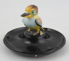 A Royal Worcester circular pin dish, with a model of a Kookaburra to the centre, diameter 4.5ins,