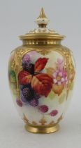 A Royal Worcester covered vase, the quarter lobed body decorated autumnal fruits and leaves by Kitty