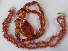 An amber necklace, with large amber pendant, together with a coral necklace