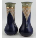 A pair of Royal Doulton stoneware vases, decorated with flowers, impressed 8348, height 12.5ins